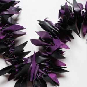 Purple and black leather boa