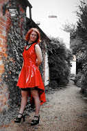 Red PVC dress with black lace trim