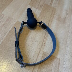 Penis dildo gag (leather strap) facing outwards