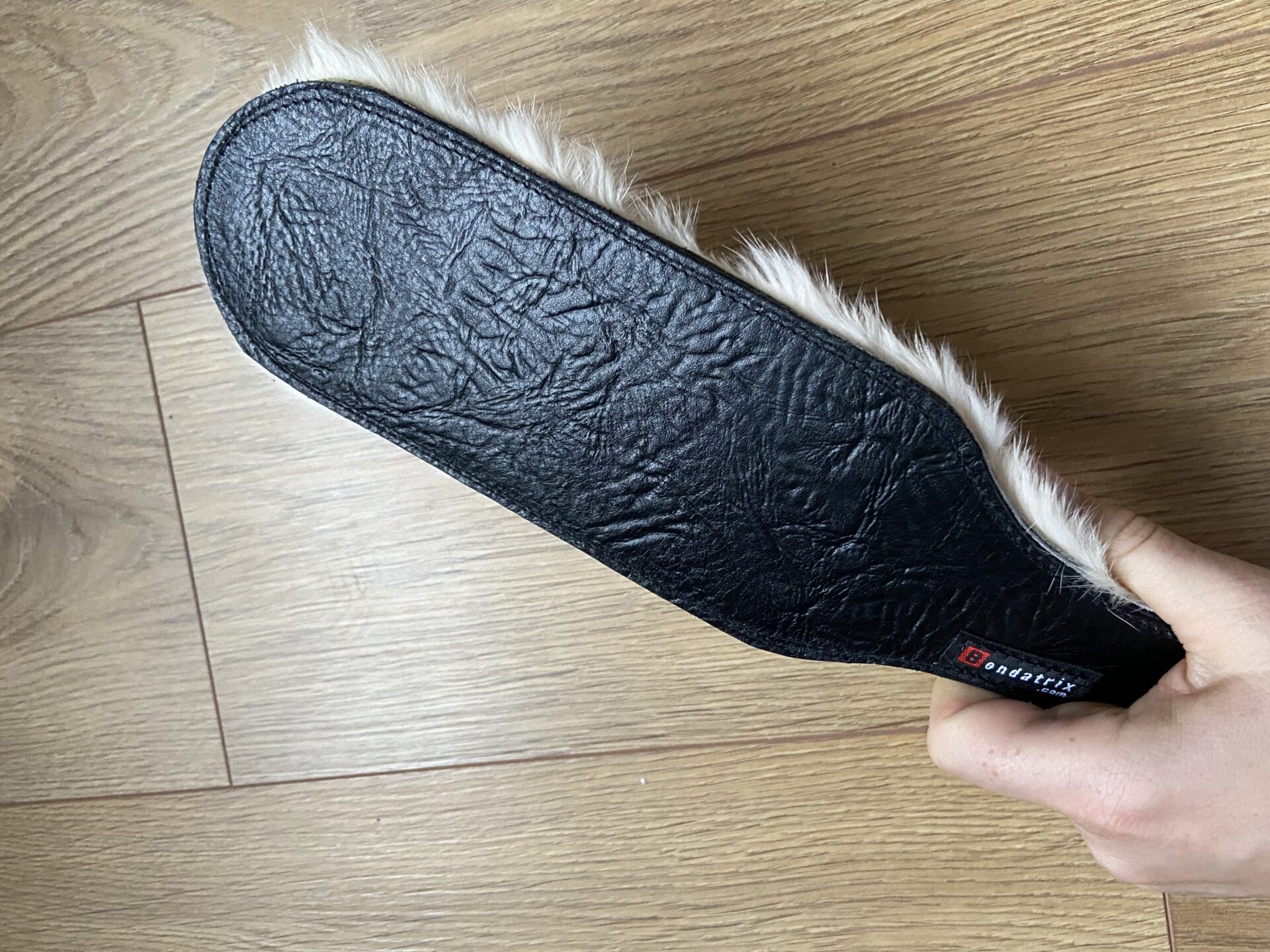 Black leather and fur paddle