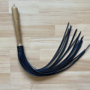 Stingy flogger on natural oak