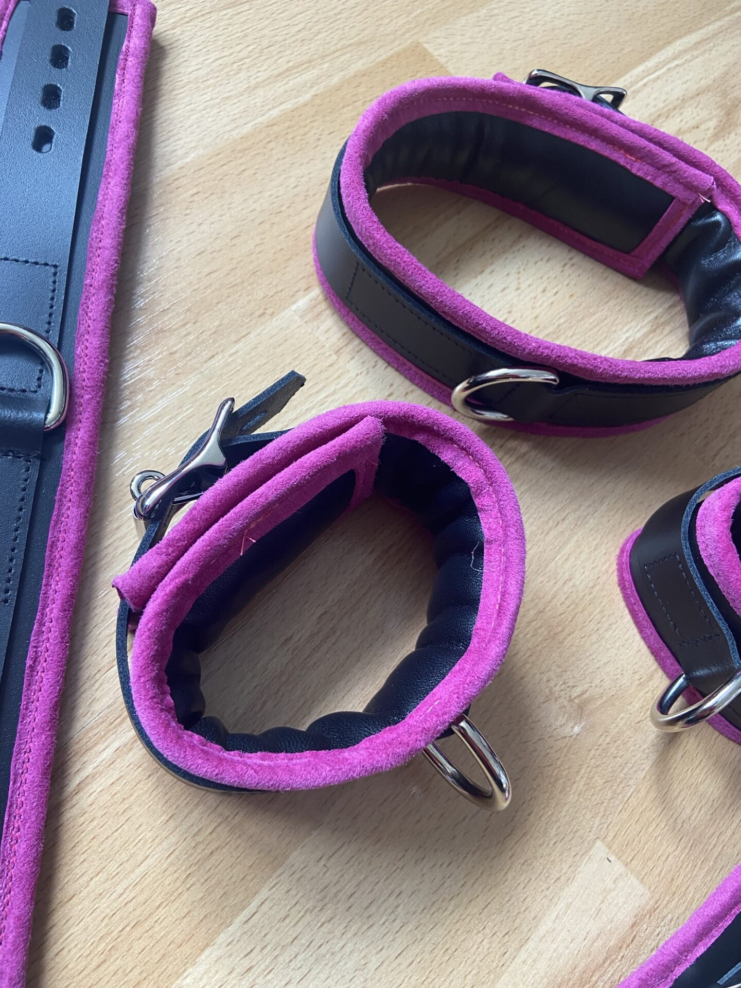 Pink BDSM bondage cuffs and collar set